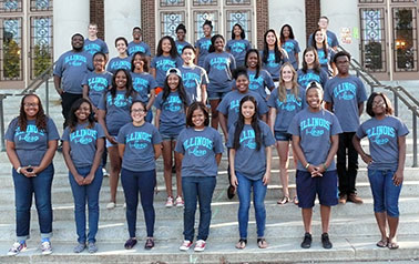 group of 25 students standing on outdoor stairs