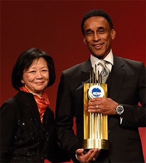 Mannie Jackson standing with Chancellor Phyllis Wise, holding the NCAA Theodore Roosevelt Award